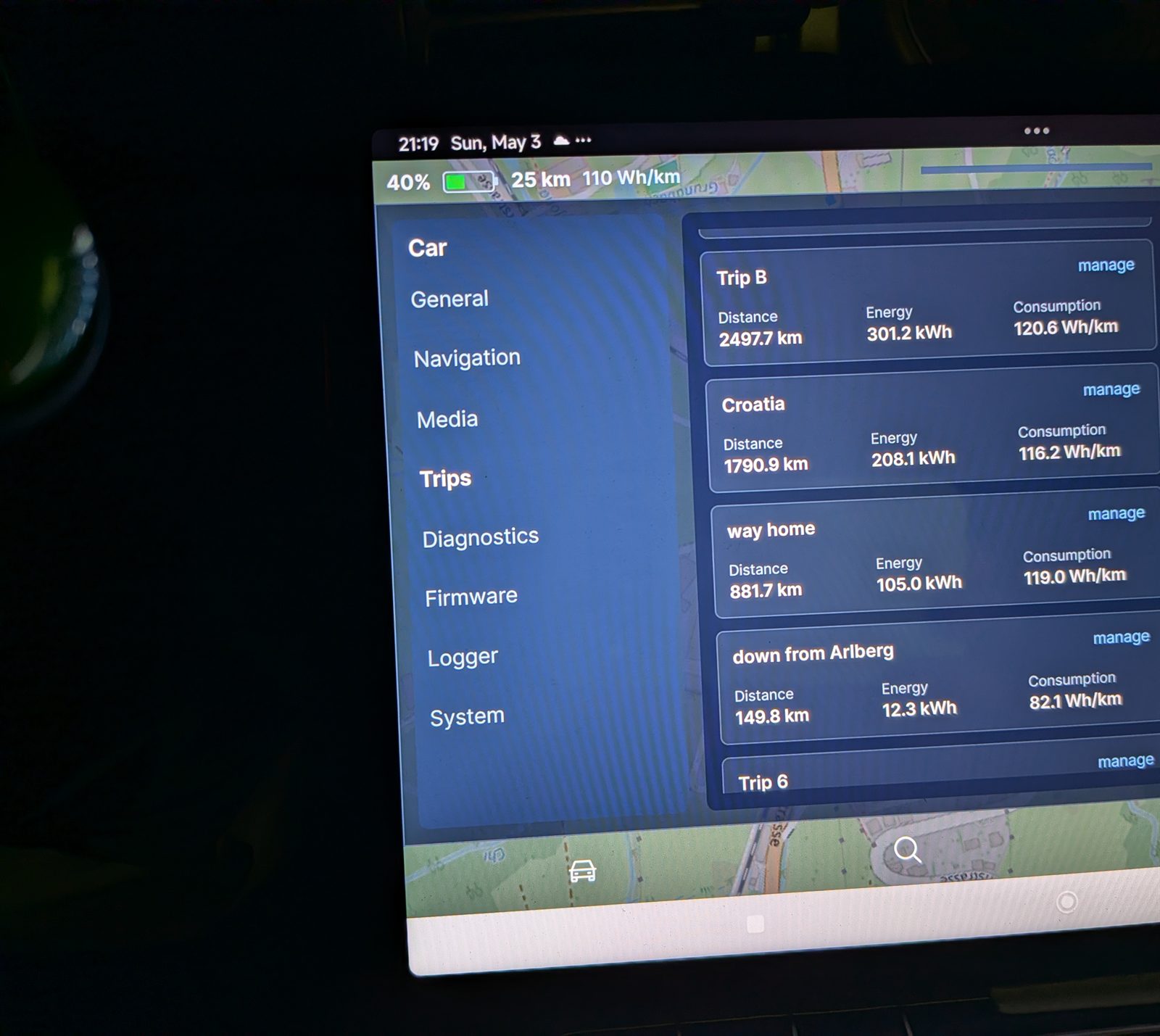 evOS Trips screen on arrival showing the round-trip and way-home counters complete at 40 percent