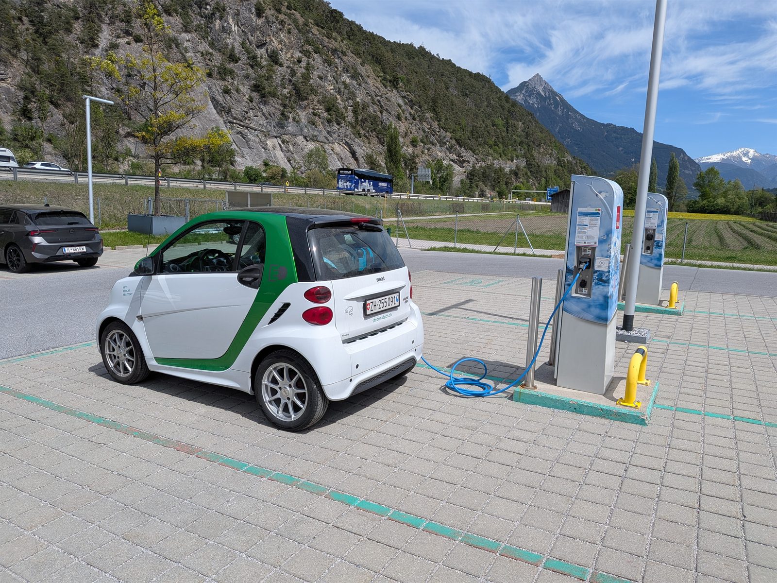 The smart ED charging near Imst on the way home, alpine peak behind